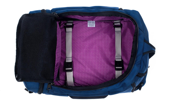 An open Techonaut 30 with a Navy exterior and an Ultraviolet (bright purple) interior.